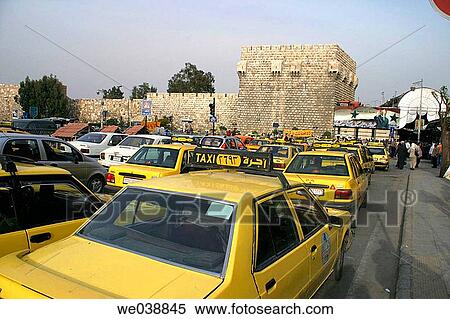 Taxis and city walls, Damascus. Syria View Large Photo Image Stock Photography - Taxis and city walls, Damascus. Syria. Fotosearch