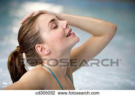 Therapeutic seawater pool (33? C) with hydrojet, underwater massage jets, waterfalls, bubbles, shoulder and neck massage waterfalls, jacuzzis, against-the-current swimming, and hot and cold plunge pools View Large Photo Image Stock Image - Therapeutic seawater pool (33? C) with hydrojet, underwater massage jets, waterfalls, bubbles, shoulder and neck massage waterfalls, jacuzzis, against-the-current swimming, and hot and cold plunge pools. Fotosearch