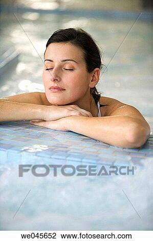 Therapeutic seawater pool (33? C) with hydrojet, underwater massage jets, waterfalls, bubbles, shoulder and neck massage waterfalls, jacuzzis, against-the-current swimming, and hot and cold plunge pools View Large Photo Image Stock Image - Therapeutic seawater pool (33? C) with hydrojet, underwater massage jets, waterfalls, bubbles, shoulder and neck massage waterfalls, jacuzzis, against-the-current swimming, and hot and cold plunge pools. Fotosearch