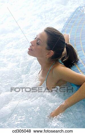 Therapeutic seawater pool (33? C) with hydrojet, underwater massage jets, waterfalls, bubbles, shoulder and neck massage waterfalls, jacuzzis, against-the-current swimming, and hot and cold plunge pools View Large Photo Image Stock Photo - Therapeutic seawater pool (33? C) with hydrojet, underwater massage jets, waterfalls, bubbles, shoulder and neck massage waterfalls, jacuzzis, against-the-current swimming, and hot and cold plunge pools. Fotosearch