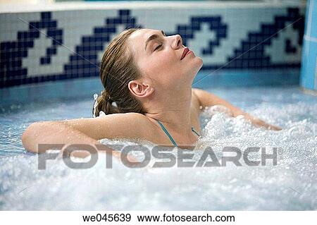 Therapeutic seawater pool (33? C) with hydrojet, underwater massage jets, waterfalls, bubbles, shoulder and neck massage waterfalls, jacuzzis, against-the-current swimming, and hot and cold plunge pools View Large Photo Image Stock Photo - Therapeutic seawater pool (33? C) with hydrojet, underwater massage jets, waterfalls, bubbles, shoulder and neck massage waterfalls, jacuzzis, against-the-current swimming, and hot and cold plunge pools. Fotosearch