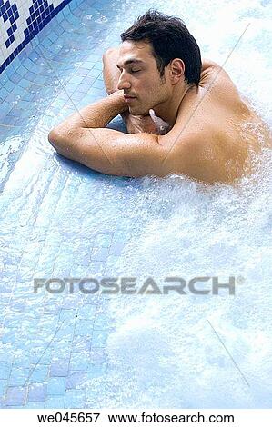 Therapeutic seawater pool (33? C) with hydrojet, underwater massage jets, waterfalls, bubbles, shoulder and neck massage waterfalls, jacuzzis, against-the-current swimming, and hot and cold plunge pools View Large Photo Image Stock Photo - Therapeutic seawater pool (33? C) with hydrojet, underwater massage jets, waterfalls, bubbles, shoulder and neck massage waterfalls, jacuzzis, against-the-current swimming, and hot and cold plunge pools. Fotosearch
