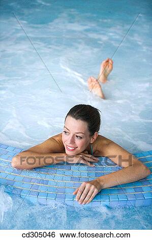 Therapeutic seawater pool (33? C) with hydrojet, underwater massage jets, waterfalls, bubbles, shoulder and neck massage waterfalls, jacuzzis, against-the-current swimming, and hot and cold plunge pools View Large Photo Image Stock Photograph - Therapeutic seawater pool (33? C) with hydrojet, underwater massage jets, waterfalls, bubbles, shoulder and neck massage waterfalls, jacuzzis, against-the-current swimming, and hot and cold plunge pools. Fotosearch
