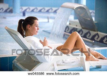 Therapeutic seawater pool (33? C) with hydrojet, underwater massage jets, waterfalls, bubbles, shoulder and neck massage waterfalls, jacuzzis, against-the-current swimming, and hot and cold plunge pools View Large Photo Image Stock Photograph - Therapeutic seawater pool (33? C) with hydrojet, underwater massage jets, waterfalls, bubbles, shoulder and neck massage waterfalls, jacuzzis, against-the-current swimming, and hot and cold plunge pools. Fotosearch