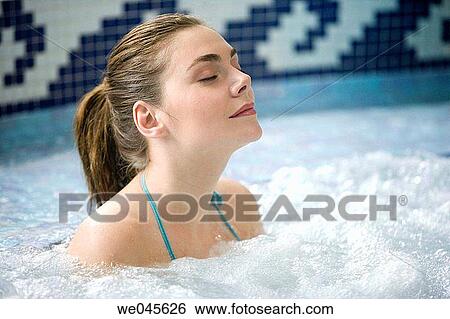 Therapeutic seawater pool (33? C) with hydrojet, underwater massage jets, waterfalls, bubbles, shoulder and neck massage waterfalls, jacuzzis, against-the-current swimming, and hot and cold plunge pools View Large Photo Image Stock Photograph - Therapeutic seawater pool (33? C) with hydrojet, underwater massage jets, waterfalls, bubbles, shoulder and neck massage waterfalls, jacuzzis, against-the-current swimming, and hot and cold plunge pools. Fotosearch