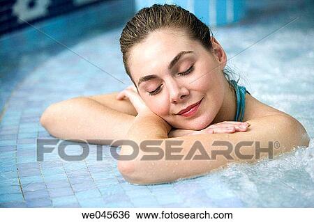 Therapeutic seawater pool (33? C) with hydrojet, underwater massage jets, waterfalls, bubbles, shoulder and neck massage waterfalls, jacuzzis, against-the-current swimming, and hot and cold plunge pools View Large Photo Image Stock Photograph - Therapeutic seawater pool (33? C) with hydrojet, underwater massage jets, waterfalls, bubbles, shoulder and neck massage waterfalls, jacuzzis, against-the-current swimming, and hot and cold plunge pools. Fotosearch