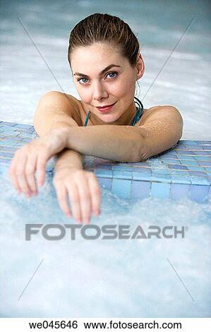 Therapeutic seawater pool (33? C) with hydrojet, underwater massage jets, waterfalls, bubbles, shoulder and neck massage waterfalls, jacuzzis, against-the-current swimming, and hot and cold plunge pools View Large Photo Image Stock Photograph - Therapeutic seawater pool (33? C) with hydrojet, underwater massage jets, waterfalls, bubbles, shoulder and neck massage waterfalls, jacuzzis, against-the-current swimming, and hot and cold plunge pools. Fotosearch