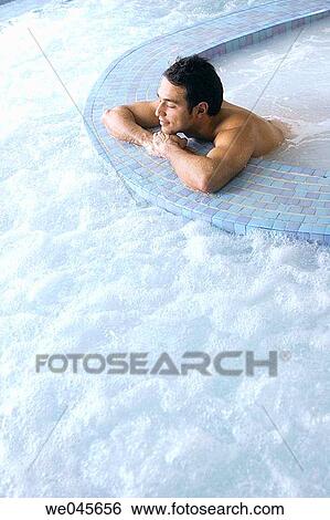 Therapeutic seawater pool (33? C) with hydrojet, underwater massage jets, waterfalls, bubbles, shoulder and neck massage waterfalls, jacuzzis, against-the-current swimming, and hot and cold plunge pools View Large Photo Image Stock Photograph - Therapeutic seawater pool (33? C) with hydrojet, underwater massage jets, waterfalls, bubbles, shoulder and neck massage waterfalls, jacuzzis, against-the-current swimming, and hot and cold plunge pools. Fotosearch