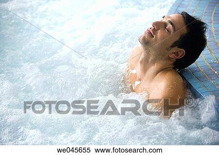 Stock Photography - Therapeutic seawater pool (33? C) with hydrojet, underwater massage jets, waterfalls, bubbles, shoulder and neck massage waterfalls, jacuzzis, against-the-current swimming, and hot and cold plunge pools. Fotosearch