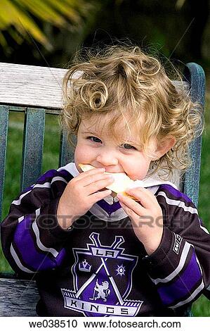 Toddler eating sandwich View Large Photo Image Stock Image - Toddler eating sandwich. Fotosearch
