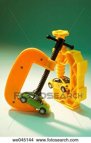 Picture - Toy clamps and miniature cars. Fotosearch