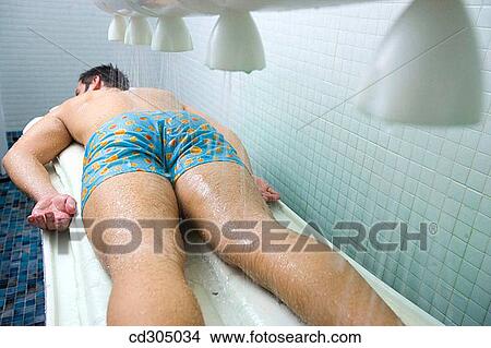Vichy Shower. Relaxing sea water shower to ease muscle tension View Large Photo Image Picture - Vichy Shower. Relaxing sea water shower to ease muscle tension. Fotosearch