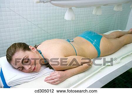 Vichy Shower. Relaxing sea water shower to ease muscle tension View Large Photo Image Stock Image - Vichy Shower. Relaxing sea water shower to ease muscle tension. Fotosearch