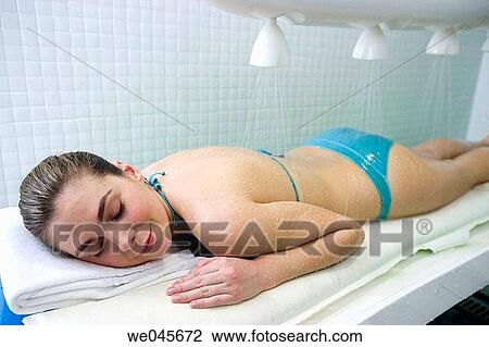 Vichy Shower. Relaxing sea water shower to ease muscle tension View Large Photo Image Stock Image - Vichy Shower. Relaxing sea water shower to ease muscle tension. Fotosearch