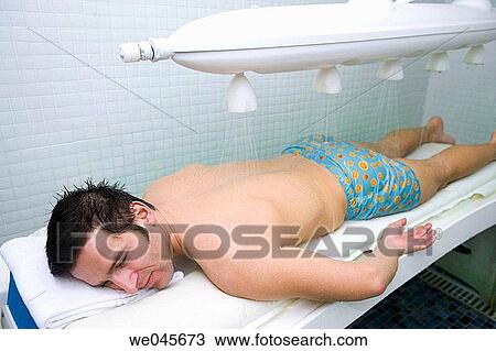 Vichy Shower. Relaxing sea water shower to ease muscle tension View Large Photo Image Stock Image - Vichy Shower. Relaxing sea water shower to ease muscle tension. Fotosearch