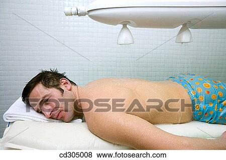 Vichy Shower. Relaxing sea water shower to ease muscle tension View Large Photo Image Stock Photo - Vichy Shower. Relaxing sea water shower to ease muscle tension. Fotosearch