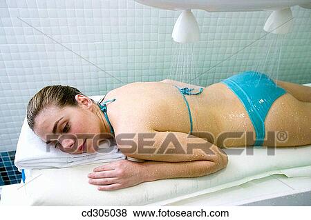 Vichy Shower. Relaxing sea water shower to ease muscle tension View Large Photo Image Stock Photo - Vichy Shower. Relaxing sea water shower to ease muscle tension. Fotosearch