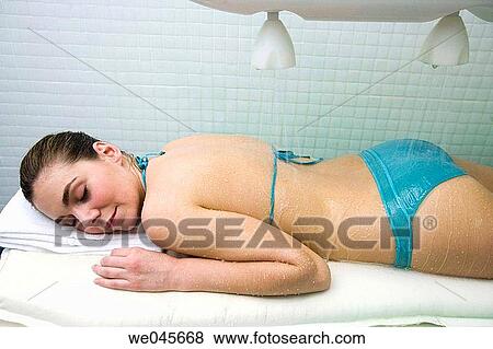 Vichy Shower. Relaxing sea water shower to ease muscle tension View Large Photo Image Stock Photo - Vichy Shower. Relaxing sea water shower to ease muscle tension. Fotosearch