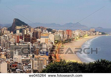 View of Ipanema Beach and Southern Zone of Rio de Janiero, Brazil from atop of Rua Apanena, Mirante do Penhasco dois Irmaos. View Large Photo Image Picture - View of Ipanema Beach and Southern Zone of Rio de Janiero, Brazil from atop of Rua Apanena, Mirante do Penhasco dois Irmaos.. Fotosearch
