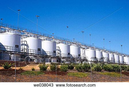 Stock Image - Viticulture, modern stainless steel wine storage tanks at winery. South Australia.. Fotosearch