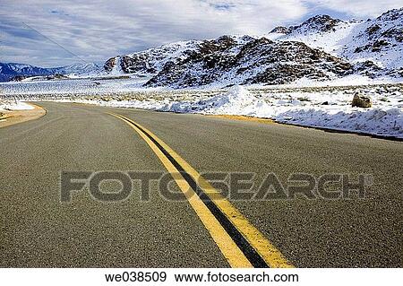 Stock Photo - Winter highway, Sierrra Nevada Range, California, USA. Fotosearch