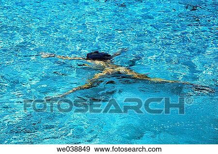 Woman diving in cristal water. Illetes beach. Formentera. Balearic Islands. Spain. View Large Photo Image Stock Photo - Woman diving in cristal water. Illetes beach. Formentera. Balearic Islands. Spain.. Fotosearch