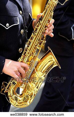 Young woman playing the saxophone. Holy Week. Albacete, Castilla-La Mancha, Spain. View Large Photo Image Stock Photo - Young woman playing the saxophone. Holy Week. Albacete, Castilla-La Mancha, Spain.. Fotosearch