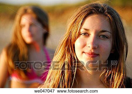 13 year old girl at beach with 18 year old sister in background View Large Photo Image Stock Photo - 13 year old girl at beach with 18 year old sister in background. Fotosearch