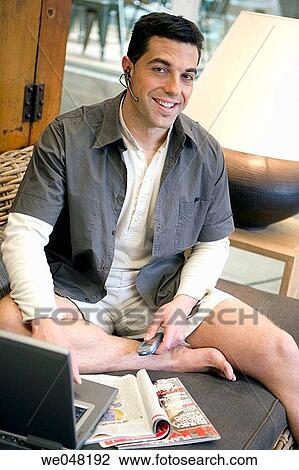 Stock Image - 30's, barefoot, at-home, 20's. Fotosearch