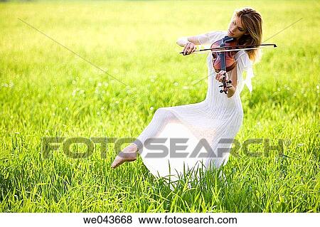 Stock Photo - 30's, barefoot, balance, art, 20's. Fotosearch