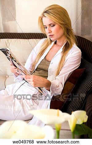 Stock Photo - 30's, browse, blond, at-home, 20's. Fotosearch