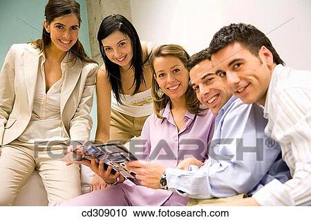 Stock Image - 30's, browsing, browse, at-home, 20's. Fotosearch