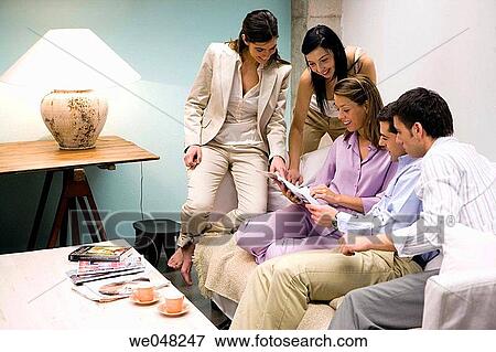Stock Photo - 30's, browsing, browse, at-home, 20's. Fotosearch