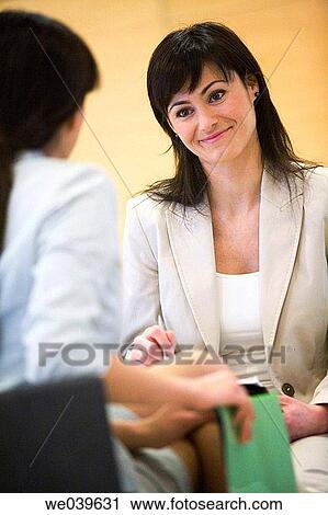 Stock Image - 30's, businesswoman, businesspeople, business, 20's. Fotosearch