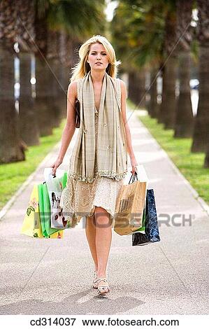 30's, carrying, carry, bag, 20's View Large Photo Image Stock Photo - 30's, carrying, carry, bag, 20's. Fotosearch