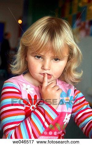 4 year old girl at nursery looking puzzled. View Large Photo Image Stock Photo - 4 year old girl at nursery looking puzzled.. Fotosearch