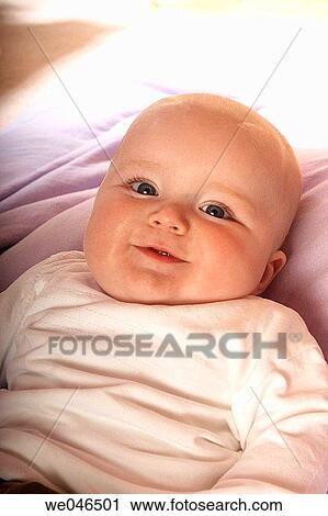 5 month old baby lying on his back smiling into camera View Large Photo Image Stock Image - 5 month old baby lying on his back smiling into camera. Fotosearch