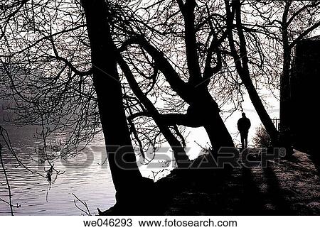 A man stands on the banks of the Vlatava in Prague winter. View Large Photo Image Stock Image - A man stands on the banks of the Vlatava in Prague winter.. Fotosearch