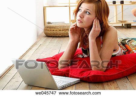 absorbed, at-home, 20's View Large Photo Image Stock Photo - absorbed, at-home, 20's. Fotosearch