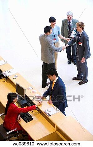Stock Image - Admission desk, businessman, business, accreditation. Fotosearch