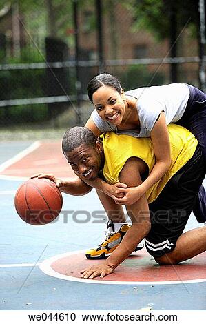 African-American girlfriend and boyfriend playing basketball View Large Photo Image Stock Image - African-American girlfriend and boyfriend playing basketball. Fotosearch