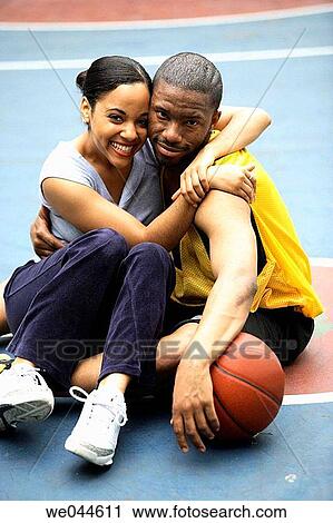 African-American girlfriend and boyfriend hugging and smiling into camera View Large Photo Image Stock Image - African-American girlfriend and boyfriend hugging and smiling into camera. Fotosearch