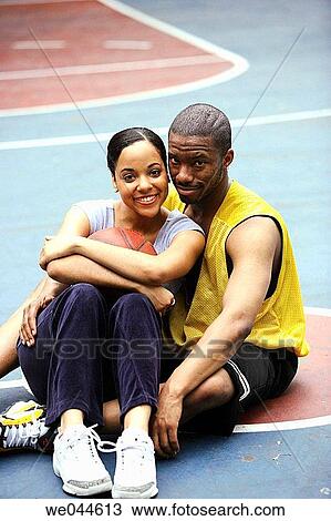 African-American girlfriend and boyfriend smiling into camera on basketball court View Large Photo Image Stock Image - African-American girlfriend and boyfriend smiling into camera on basketball court. Fotosearch