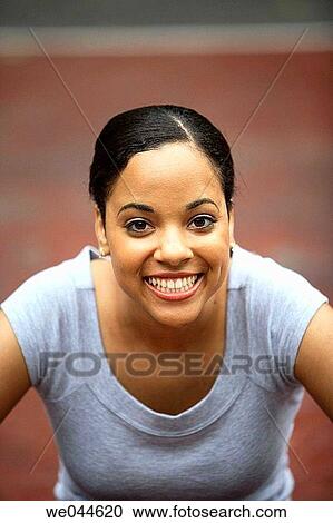 African-American woman smiling into camera View Large Photo Image Stock Image - African-American woman smiling into camera. Fotosearch