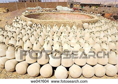 Picture - Ancestral pottery workshop near Maruza, between Qena and Luxor, using locally extract argile. Egypt. Fotosearch