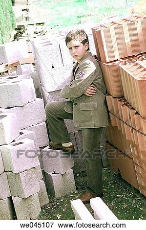 Arms crossed, Building material, boy, arms folded, angry View Large Photo Image Stock Photo - Arms crossed, Building material, boy, arms folded, angry. Fotosearch
