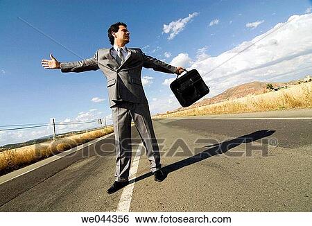 Arms open, business, briefcase, 30's View Large Photo Image Stock Photograph - Arms open, business, briefcase, 30's. Fotosearch