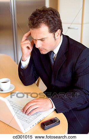 Stock Photography - at-home, businesspeople, businessman, business, 30's. Fotosearch