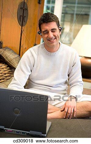 Stock Photo - at-home, calm, barefoot, 30's. Fotosearch