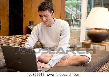 Stock Photograph - at-home, calm, barefoot, 30's. Fotosearch